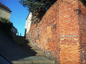 2. Remains of old buildings and steps up to main road, Coombes Wood S.jpg