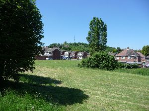 Site of spring at top of Tower Road (below silver car).jpg