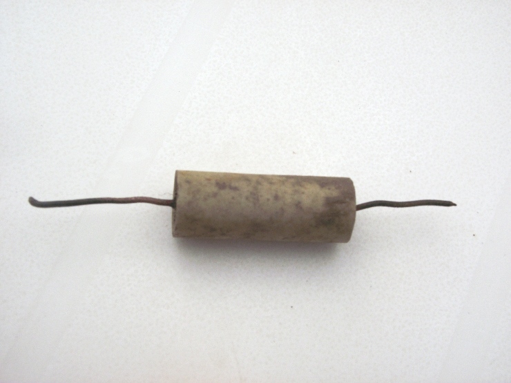 Something electrical? Ceramic and copper wire.