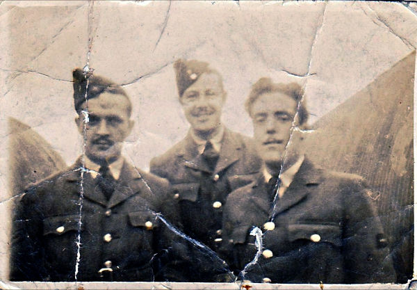 the first shows a group of RAF guys sat outside a hut ( my grandad is the one on the right)